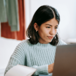 Woman working a job on a laptop.