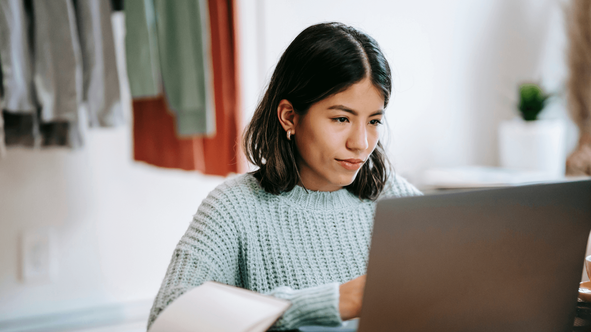 Woman working a job on a laptop.