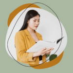 Woman looking through white folder.