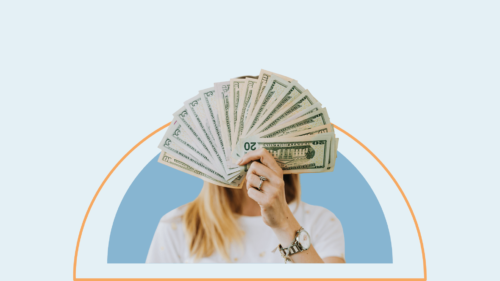 Woman holding cash.